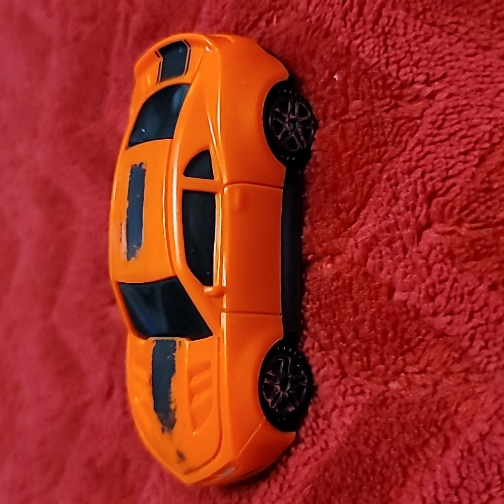 Kinsmart Plastic 1/64 Scale 2017 Chevrolet Camaro Red w/ black stripe.